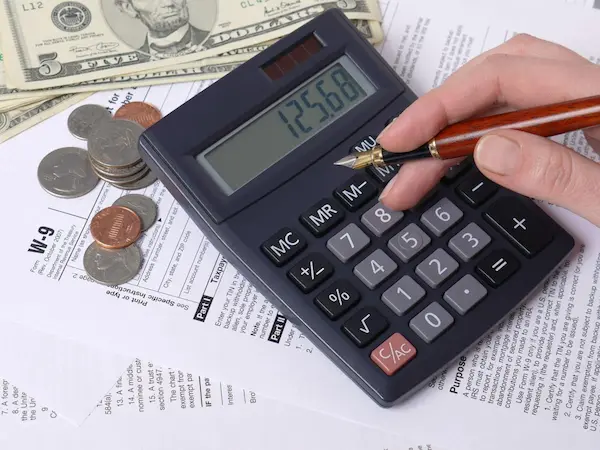 Government revenue and taxation represented by coins, tax forms, and a calculator.